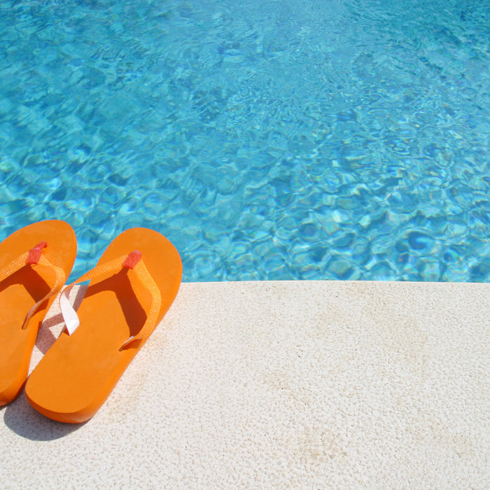 orange flip flops by pool